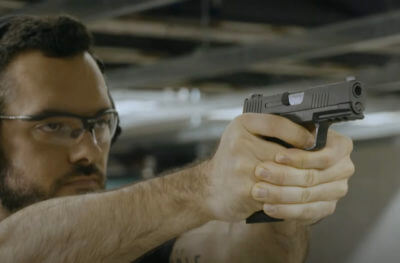 Man with new SIG handgun.