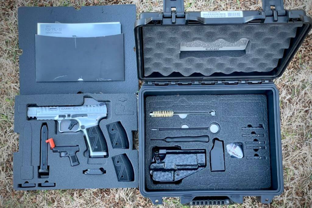 CANiK SFx RIVAL-S in hard case with all included contents to include: two 18-round magazines, two aluminum magazine base plates, a magazine loader, an external magwell, a custom holster, a tool kit, a cleaning kit, five different optic plates, an additional red and green fiber optic insert, three grip back straps, three magazine release extensions, manual, and a durable hard travel case.
