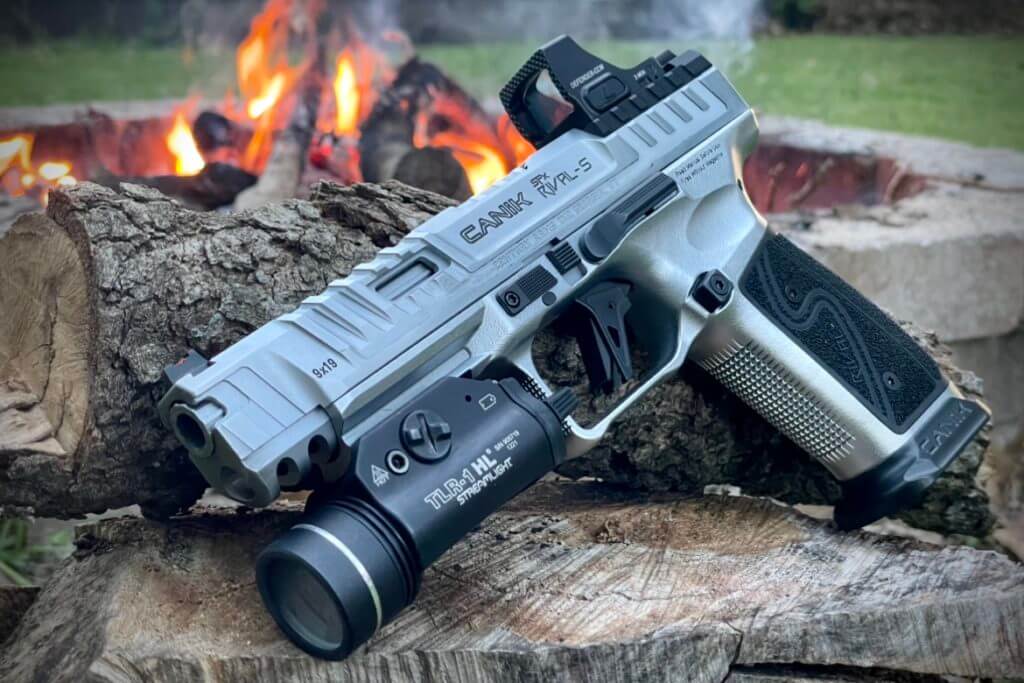 Canik SFx RIVAL-S perched near a fire decked out with Streamlight TLR-1 HL