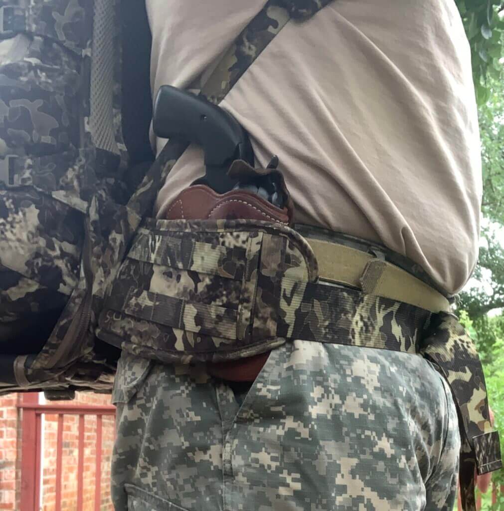 Holster paired with camo clothing