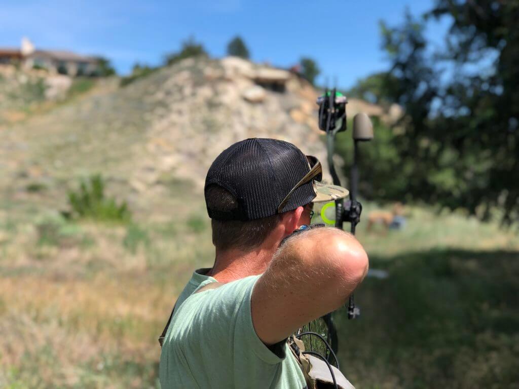 Hunter with bow, ready to shoot