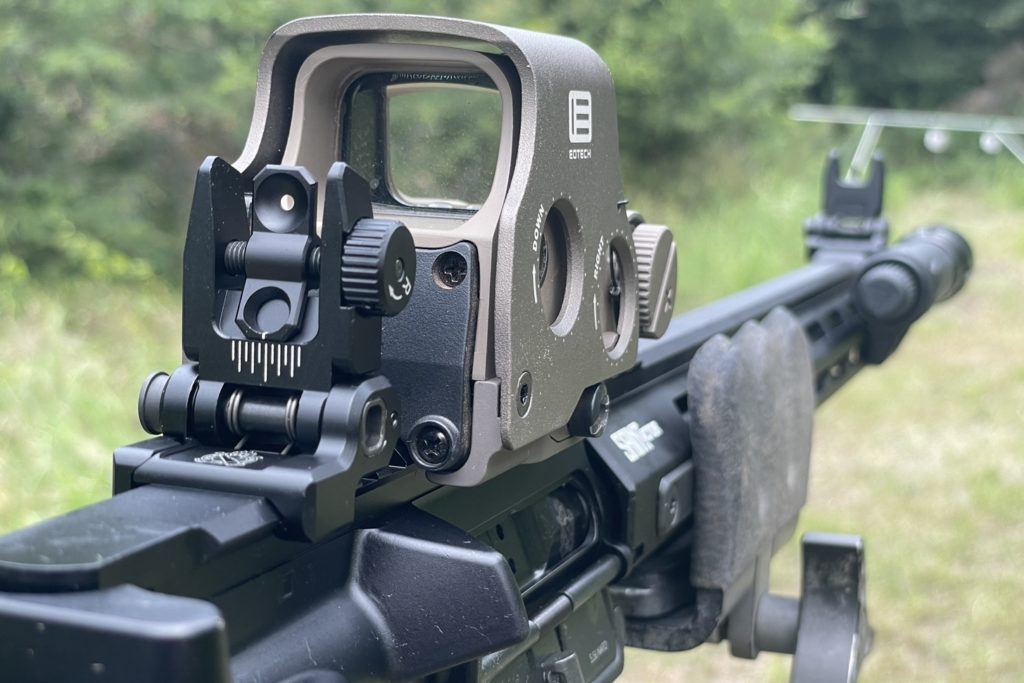Adjustable pop up iron sights work like a charm, and are a great backup when using a red dot or holographic sight such as this Eotech EXPS3-0